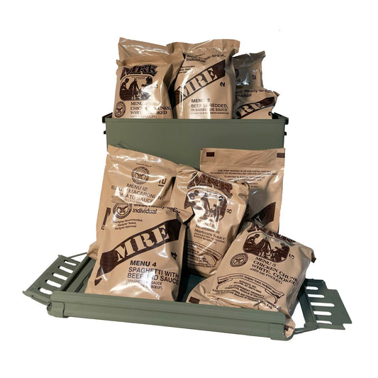 Case of military MRE meals displayed in a green ammo can, featuring assorted menus like spaghetti with beef, chicken chunks, and beef in BBQ sauce — ready-to-eat field rations for emergency or outdoor use.