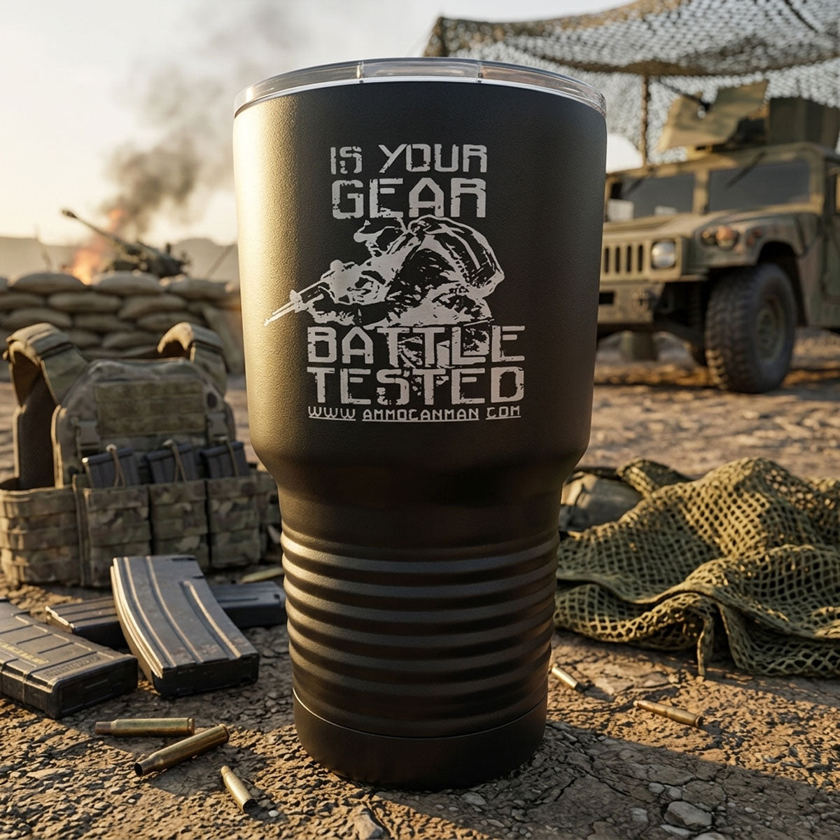 Black tumbler with military-themed text and graphics in a desert setting with military equipment.